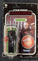 Front view of sealed Grand Inquisitor action figure on retro card showing figure, accessory, and card graphics