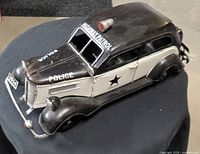 Three-quarter front view showing overall design, police markings, and licence plate 1914