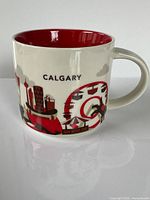 Front view showing Calgary skyline design and red interior