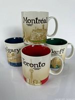 All four city mugs front view