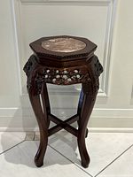 Full view of rosewood octagonal pedestal table front profile