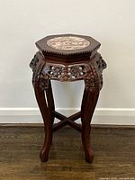 Full view of table front showing marble top, carved apron, legs