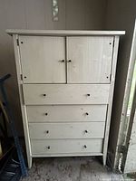 Full view of dresser front showing cabinet doors and four drawers