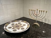 Menorah and Seder plate together on counter