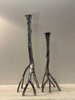 Both silver plated branch-form candlesticks full view