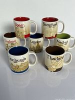 Front view of all seven Starbucks city espresso mugs