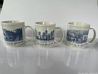 Front view of all three city mugs