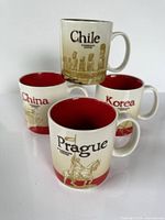 Four Starbucks city mugs front view showing city names and graphics