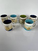 All six Starbucks city mugs displayed together