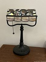 Front view of stained glass desk lamp showing shade pattern and base