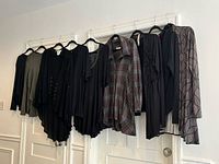 All eight tops hanging to show colors and styles