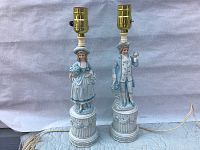 Pair of porcelain bisque figural lamps showing front full view of male and female figures on white background