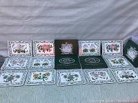 Full layout of all 12 rectangular placemats with botanical motifs and original packaging