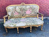 Full front view of gilded wood settee with tapestry upholstery