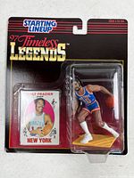 Front view of sealed action figure and card on cardback