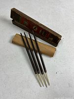 Four wood-handled files and original box displayed