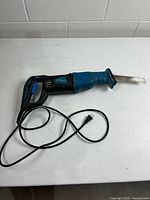 Full view of PowerGlide reciprocating saw with cord and blade