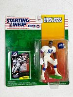 Front of sealed blister card showing figure, helmet and trading card