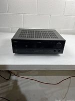 Front angled view of Yamaha HTR-5540 receiver on table