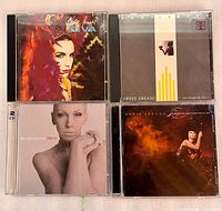 Four CD albums arranged in grid showing front cover artwork