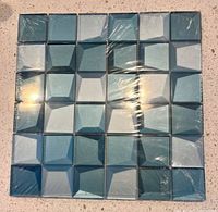 Unopened sheet of blue glass mosaic tiles