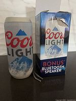 Front view showing Coors Light graphics on speaker and box