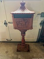 Full view showing mailbox on pedestal