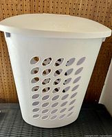 Front view of white Sterilite hamper with lid attached