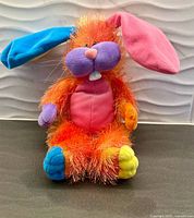 front view of multicolour plush bunny