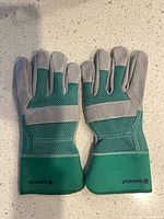 Top view of Gardena gardening gloves showing mesh backs and logo on cuffs