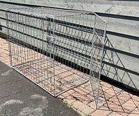 Full view of metal wire cage showing overall size and structure