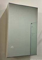 Front view of mirrored medicine cabinet