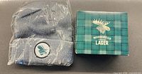 Toque sealed in plastic beside branded Moosehead Lager box