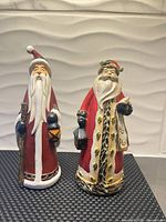 Front view of both Santa figurines
