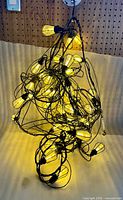 Overview of tangled string lights illuminated