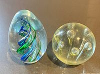 Both paperweights side by side