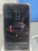 Front view of iPod touch displaying low-battery icon