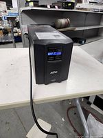 Front view of APC Smart-UPS 1500 showing LCD and controls