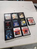Front view of all ten Atari cartridges showing label condition