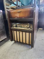 Front view showing cabinet, control panel, speaker grille and Arizona badge