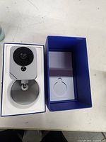 Camera and open box showing fitted insert and mounting base