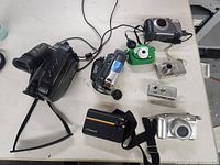 All eight devices arranged on table
