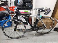 Full side view of Cervelo bicycle showing frame, wheels, aero bars