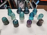 Group view of all 12 insulators showing size and colour range