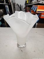 Full view of white ruffled vase front