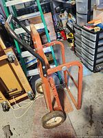 Full view red Haul In One hand truck