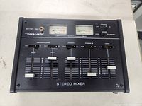 Front view showing Realistic stereo mixer controls and meters