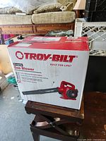 Front of sealed box showing Troy-Bilt TB430 gas blower branding and image of product
