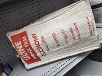 Full view of unopened Uline shrink film box showing model, size and gauge information