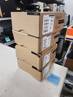 Stack of four Yealink Prime Business Phone boxes